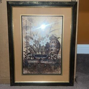 Beautiful black and gold frame with flowers and vase